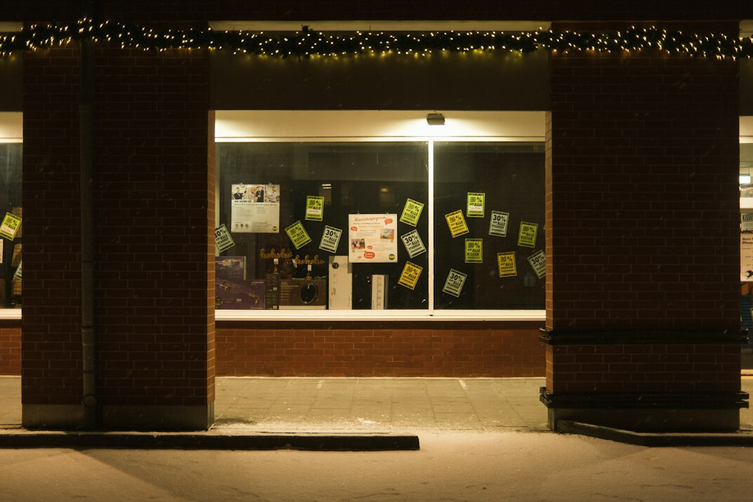Facilitator leading a strategy workshop with sticky notes on a wall